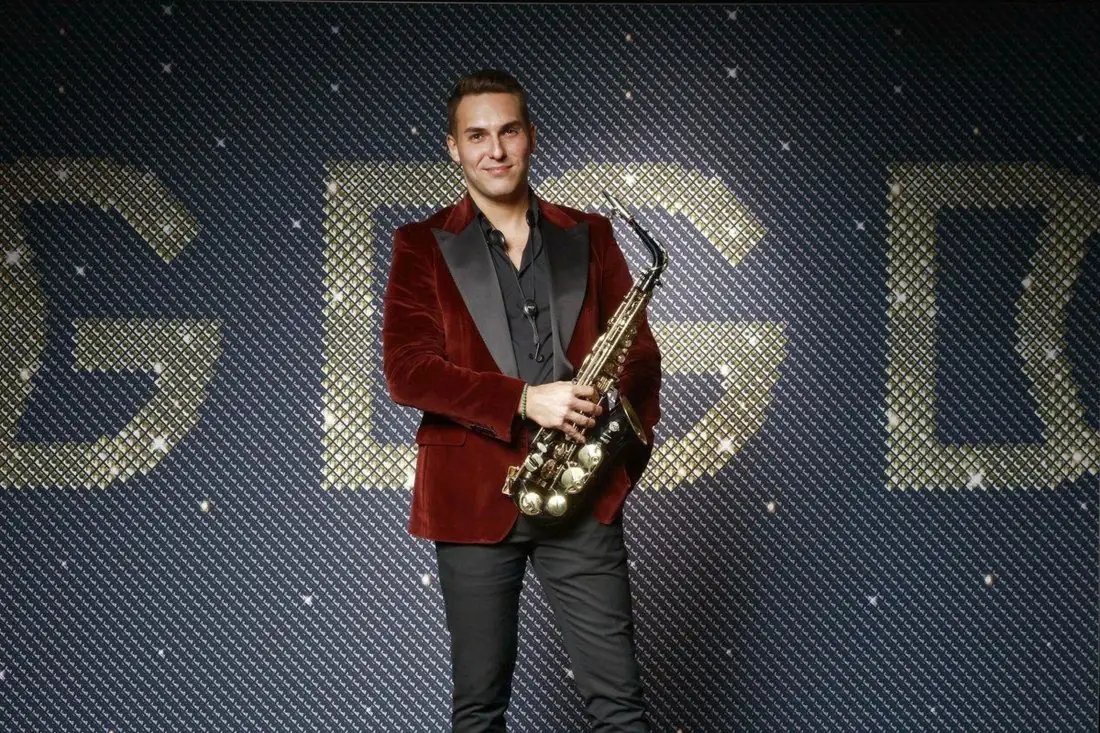 Saxophonist in a velvet jacket at a corporate gala
