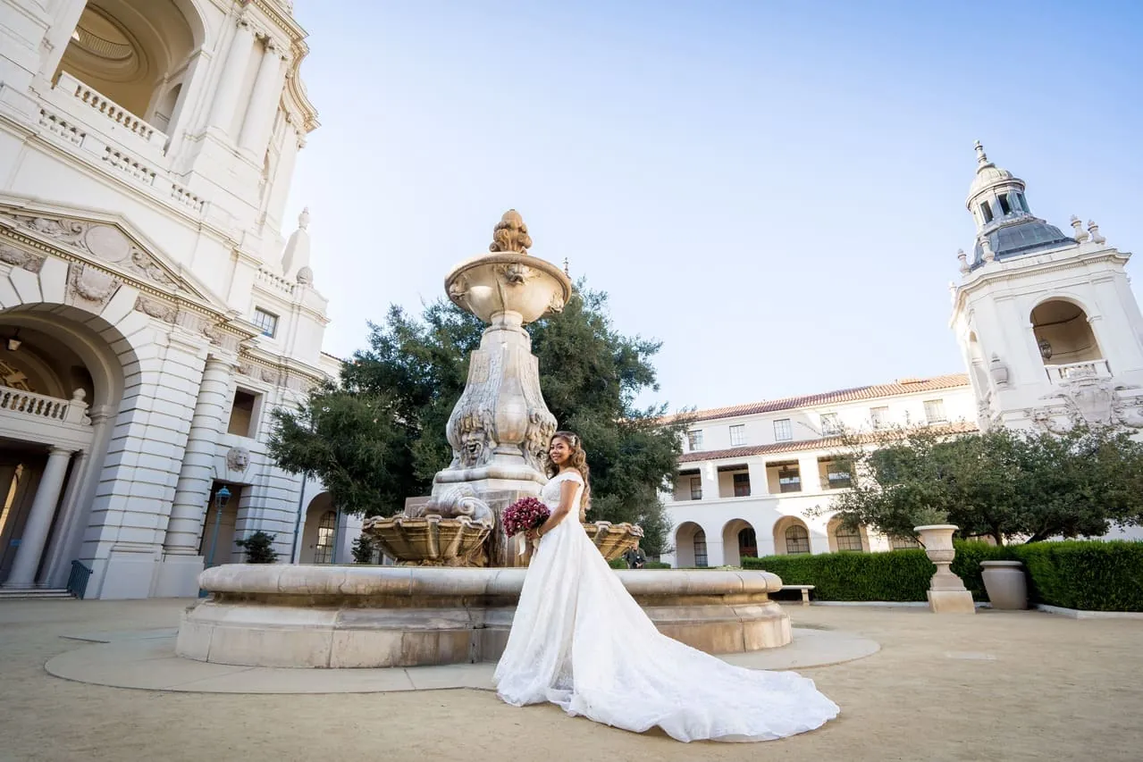 Bride in front of a fountain at a Southern California wedding venue